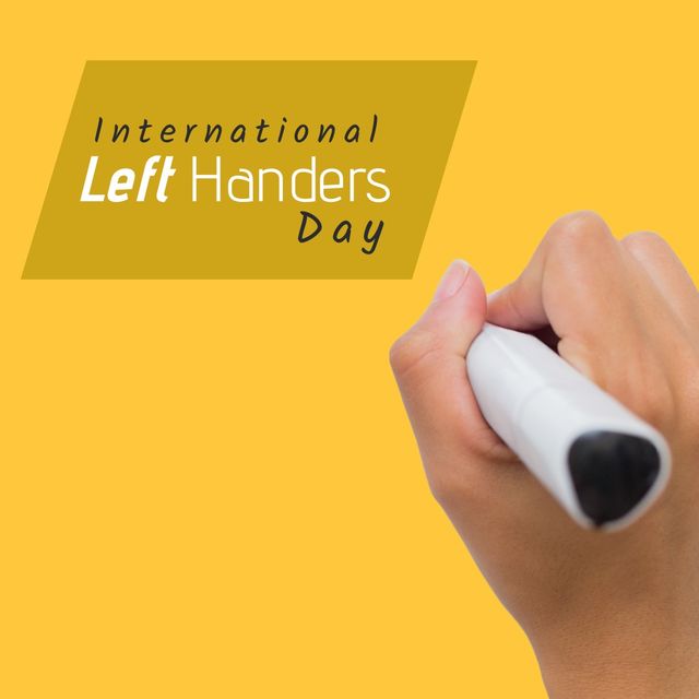 Cropped hand of caucasian person holding felt-tip pen and international left handers day text. Copy space, yellow background, composite, unique, lefty, problems, celebration and awareness concept.