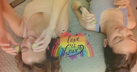 Couple relaxing with cucumber slices over eyes, selfcare moment with rainbow love is love heart