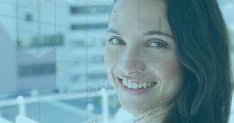 Caucasian Female Consultant with Financial Charts in Background