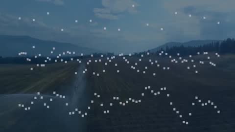 Automated Irrigation System Spraying Water over Crops