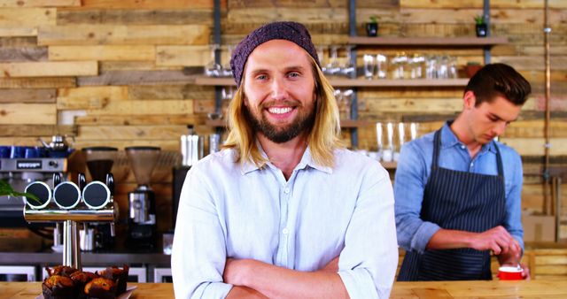 Smiling Barista Standing at Coffee Shop Counter with Barista Making Drink - Download Free Stock Images Pikwizard.com