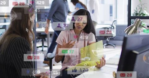 Businesswoman reviewing documents in modern open office with social media overlays