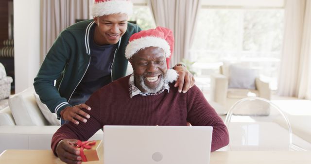 Happy Senior Receiving Christmas Gift While Using Laptop - Download Free Stock Images Pikwizard.com