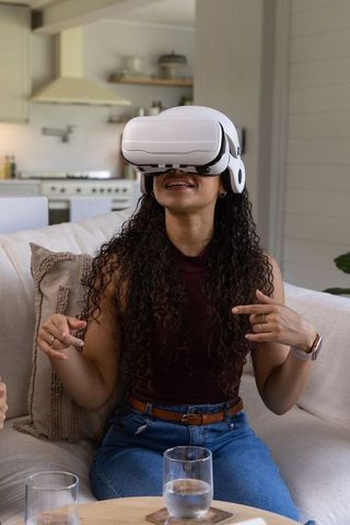 African american woman wearing vr headset enjoying immersive virtual reality experience