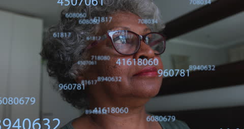 Senior Woman Analyzing Digital Data with a Thoughtful Expression