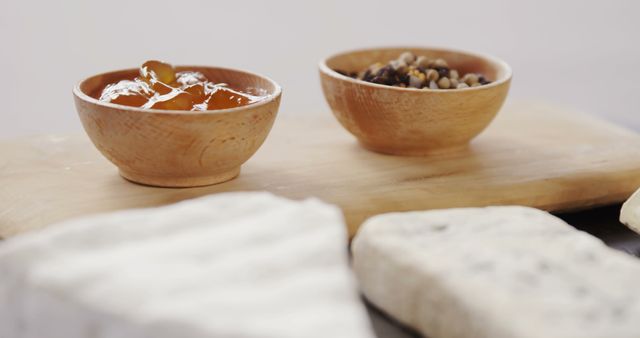 Artisan Cheese Platter with Condiments on Wooden Board - Download Free Stock Images Pikwizard.com