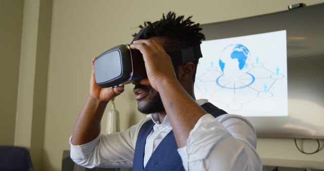 Businessperson Experimenting with Virtual Reality in Office - Download Free Stock Images Pikwizard.com