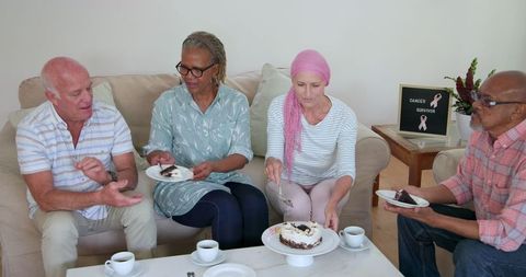 Senior friends eating cake together celebrating friendship