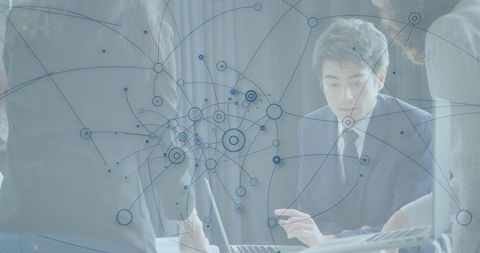 Business Team Analyzing Network Connections in Modern Office