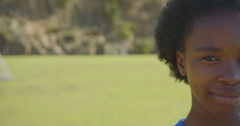 Joyful Child Smiling in Sunny School Field