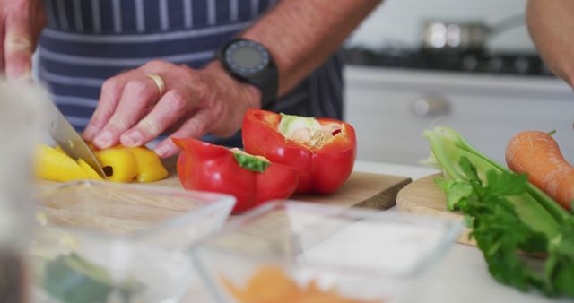 Man Chopping Bell Peppers in Kitchen for Healthy Meal Preparation - Download Free Stock Images Pikwizard.com