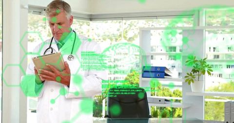 Senior doctor analyzing medical data with advanced graphics