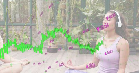 Woman meditating with headphones in greenhouse with stock charts overlay