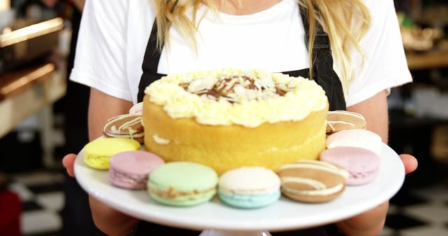Portrait of waitress holding dessert on cake stand in cafe 4k