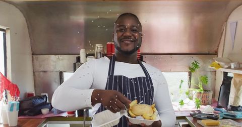 Chef Serving Fresh Street Food from Vibrant Food Truck