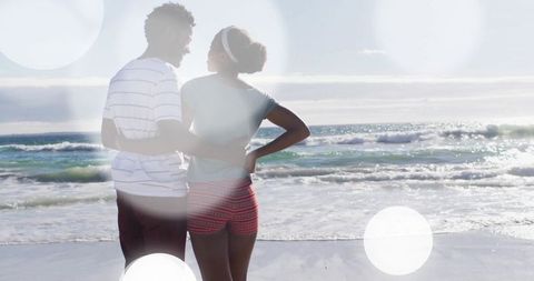 Romantic Couple Embracing by the Seaside at Sunset