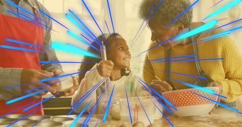 Multigenerational Baking Scene Smiling Granddaughter Whisking Batter at Kitchen Counter