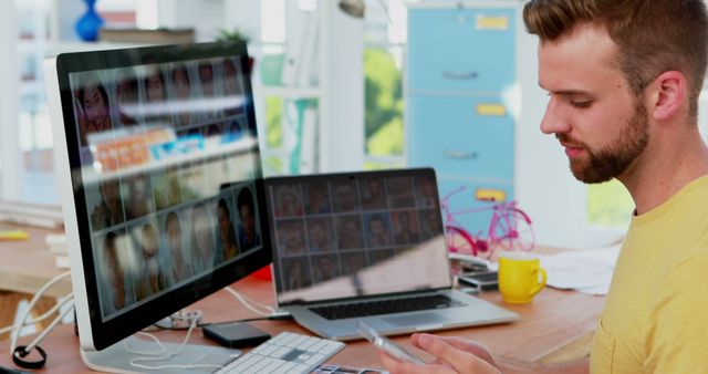 Young Male Photographer Editing Photos at Workspace - Download Free Stock Images Pikwizard.com