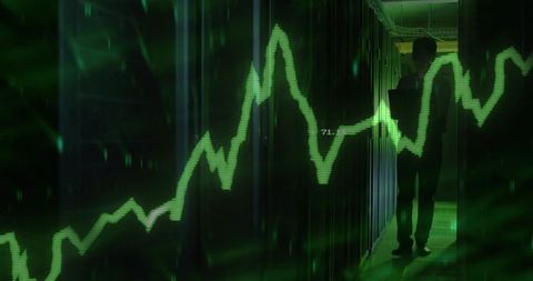 It technician monitoring server racks with green waveform overlay in datacenter corridor