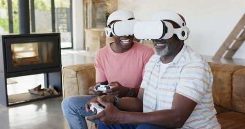 Father and Son Enjoying Virtual Reality Gaming Together