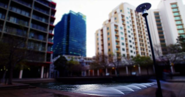 Modern Urban Buildings Surrounding Tranquil City Fountain - Download Free Stock Images Pikwizard.com