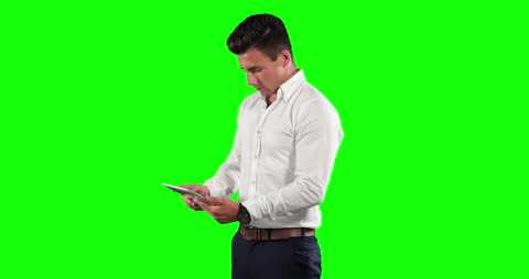 Professional Businessman Using Tablet on Green Screen