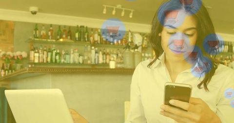 Woman Engaging in Online Shopping in Vibrant Cafe Atmosphere