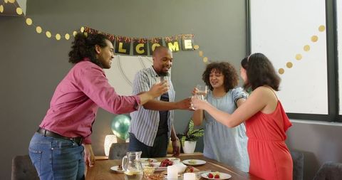 Friends Toasting in Living Room Celebration