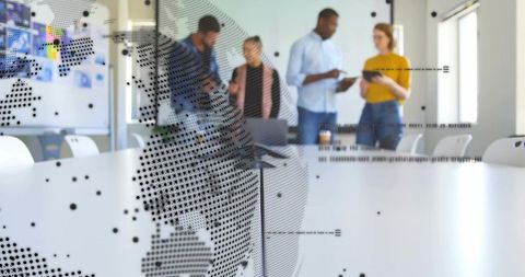 Collaborating at conference table with dotted world map on glass, planning global projects