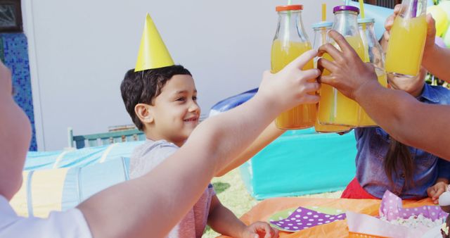 Happy Kids Toasting with Juice at Outdoor Birthday Party Celebration - Download Free Stock Images Pikwizard.com