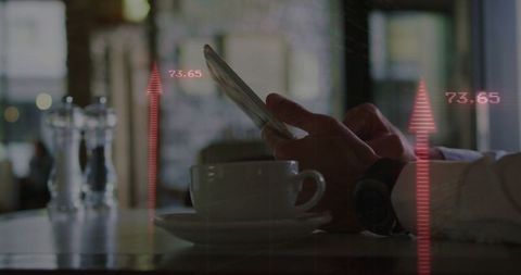 Businessman Analyzing Data on Smartphone in Urban Cafe