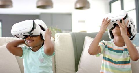 Children Engaging with Virtual Reality Headsets in Modern Living Room