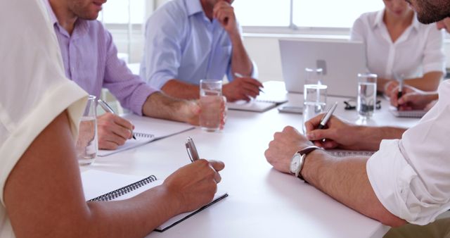 Business Meeting with Professionals Discussing Strategy Around Table - Download Free Stock Images Pikwizard.com