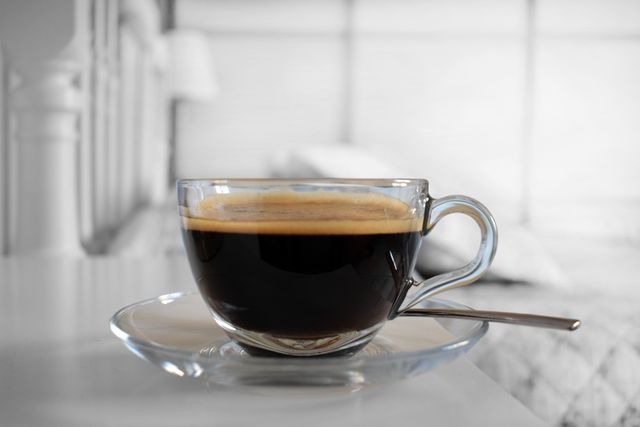 Close-Up Of Fresh Black Coffee In Glass Cup On Saucer - Download Free Stock Photos Pikwizard.com