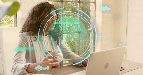 Remote worker using augmented reality interface with laptop HUD technology at home office