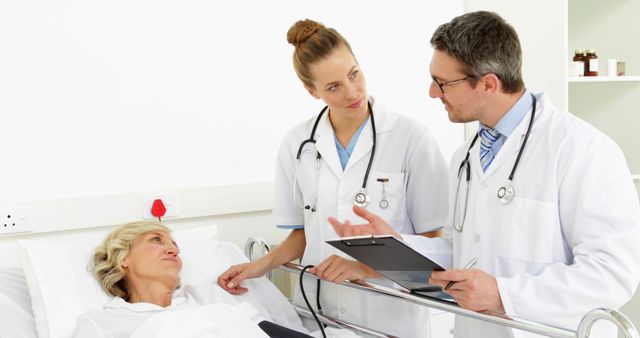 Doctors Discussing Patient's Condition in Hospital Room - Download Free Stock Images Pikwizard.com