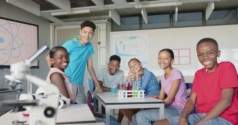 Excited Students Collaborating in Science Classroom