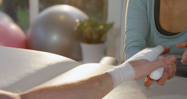 Therapist Bandaging Hand during Physical Therapy Session - Download Free Stock Images Pikwizard.com