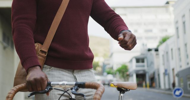 Urban Cyclist With Messenger Bag Riding Through City Streets - Download Free Stock Images Pikwizard.com