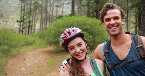 Cheerful Young Adults Enjoying Hiking Adventure in Forest