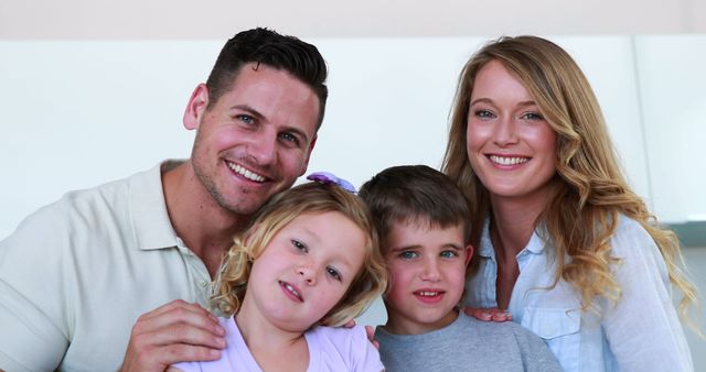 Happy Family of Four Smiling at Camera Indoors - Download Free Stock Images Pikwizard.com