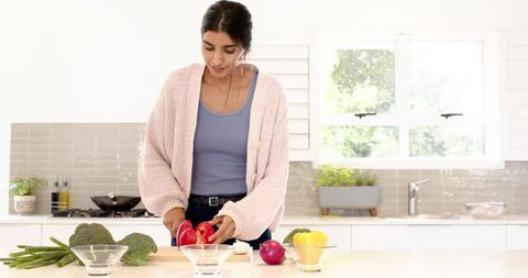 Woman Preparing Vegetables for Healthy Homemade Meal