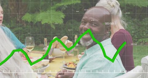 Smiling senior man at backyard dinner with wine and rising green growth graph overlay