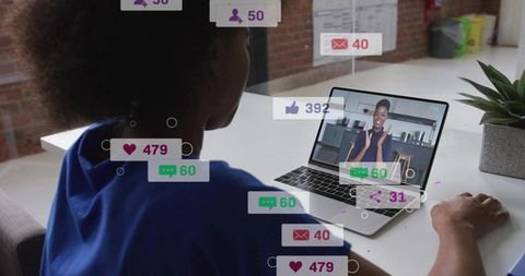 Woman joining virtual meeting on laptop with floating social engagement graphics