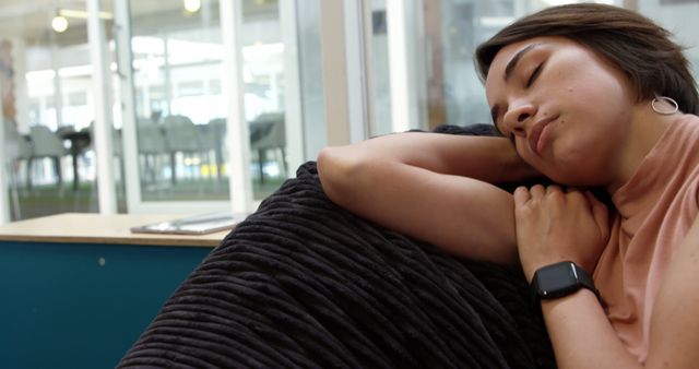 Young Professional Napping on Armchair in Modern Office - Download Free Stock Images Pikwizard.com