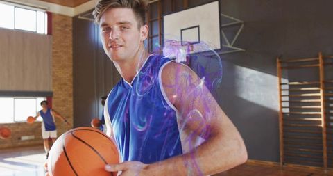 Energetic Basketball Player Holding Ball in School Gym