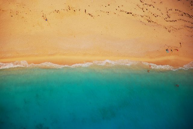 Overhead aerial view of a beach and sea waves. summer vacation and holiday concept