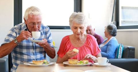 Senior Couple Enjoying Breakfast in Cozy Dining Room - Download Free Stock Images Pikwizard.com
