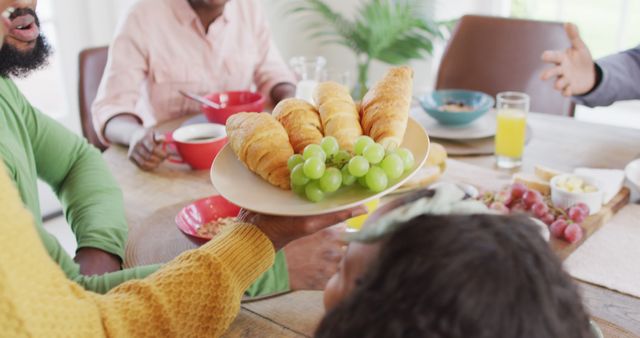 Family Enjoying Breakfast with Fresh Croissants and Grapes - Download Free Stock Images Pikwizard.com