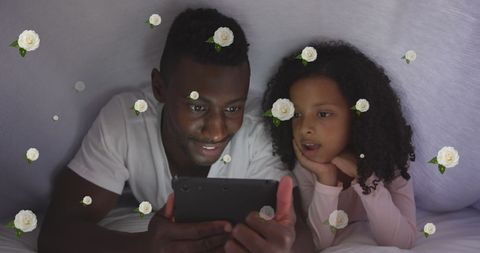 Father Daughter Bonding with Tablet Surrounded by Roses